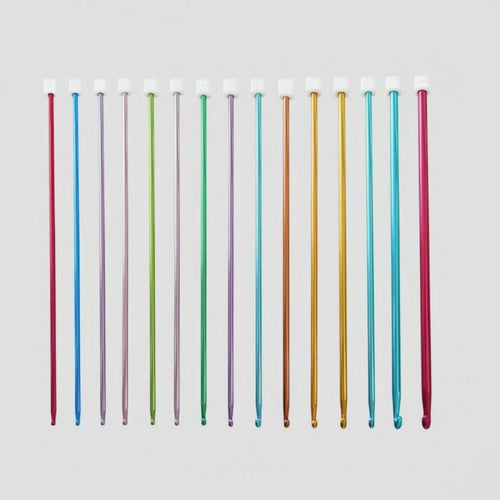 Set of colorful aluminum crochet hooks arranged on a white background.